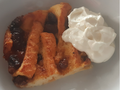 Bread and butter pudding served with clotted cream
