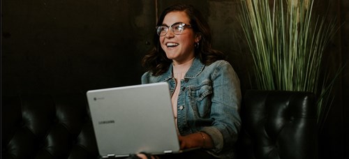 Photograph of young lady using a computer