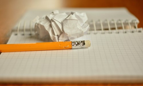 An image of a notepad and pencil