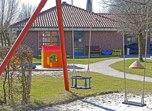 A photo of swings in a playground